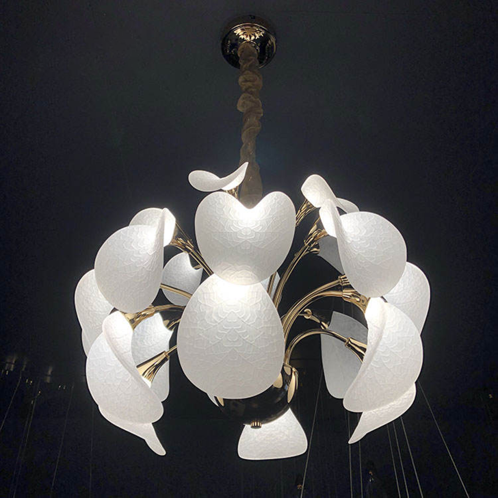 Upward view of glowing floral leaf chandelier showing white optical acrylic shades and gold zinc alloy branches