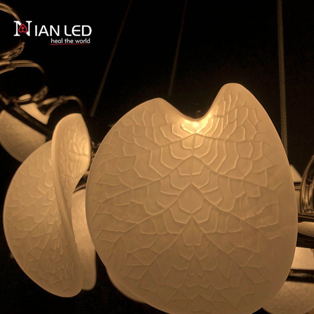 Close-up of etched optical acrylic leaf shade with vein texture attached to mirror-polished chrome steel ring frame