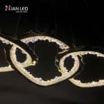 Close-up of interlocking gold zinc alloy rings with glowing crushed ice optical acrylic diffusers