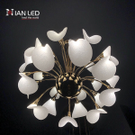 360 degree glowing spherical blooming petal LED chandelier with electroplated gold zinc alloy frame against dark background