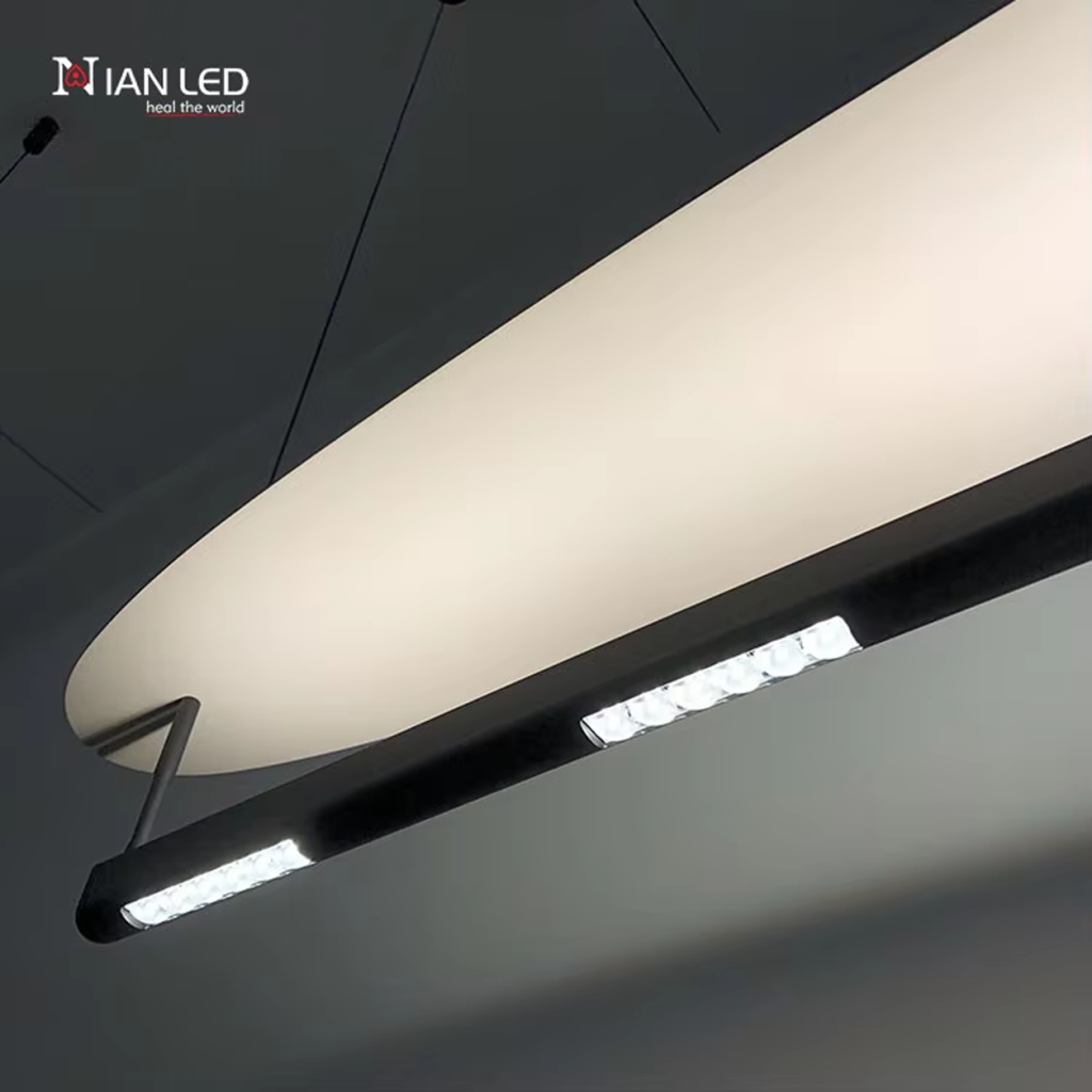 Close-up of sleek sandblasted aluminum surfboard reflector wing attached to a black aluminum connector arm