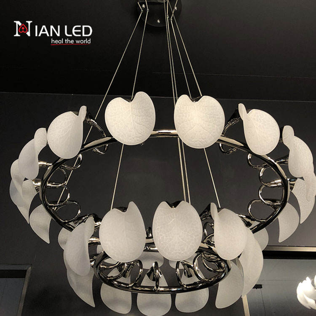 Close-up of etched optical acrylic leaf shade with vein texture attached to mirror-polished chrome steel ring frame