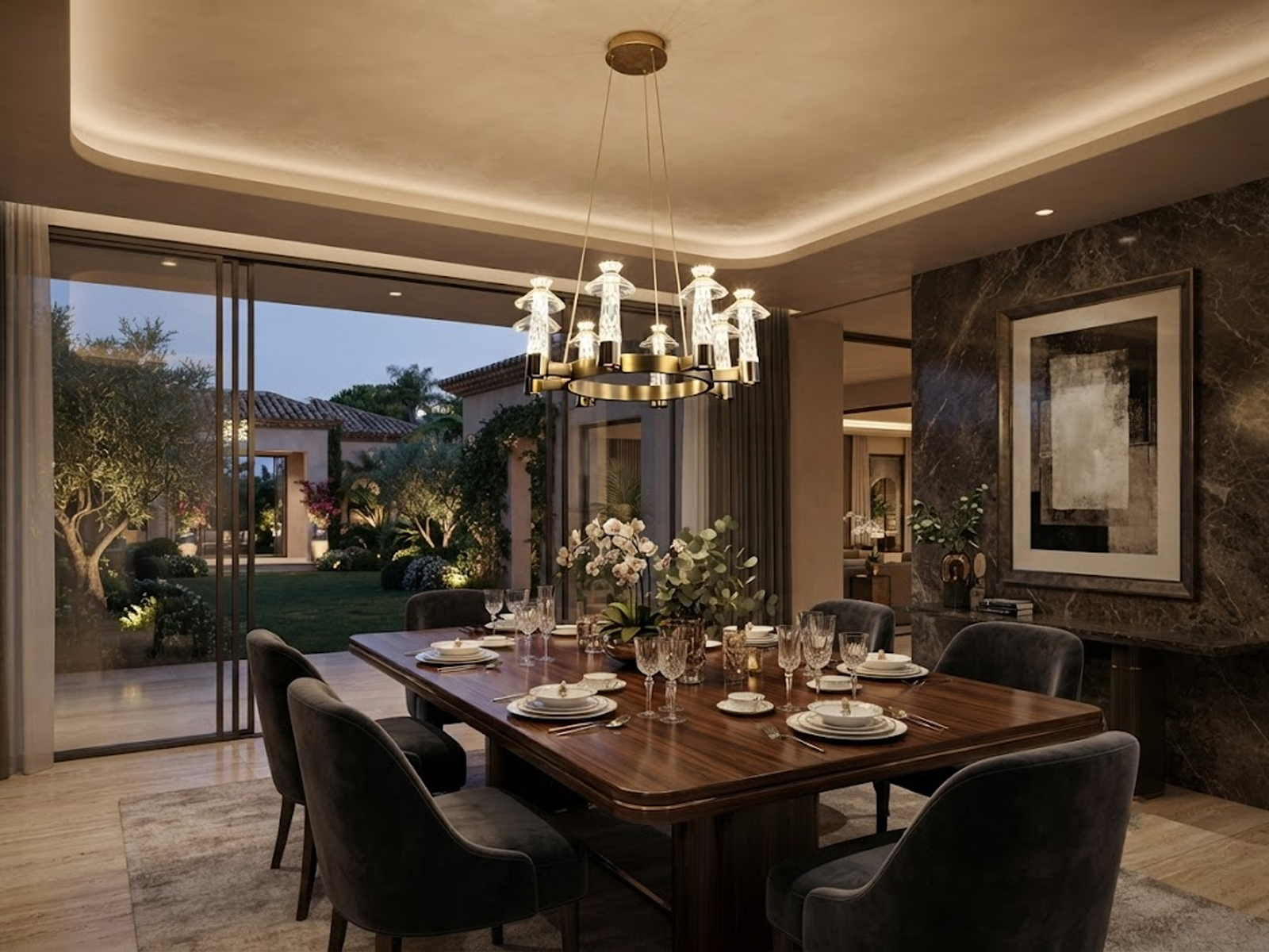 Carved crystal ring chandelier with brushed brass stainless steel frame suspended over a marble dining table in a luxury dining room