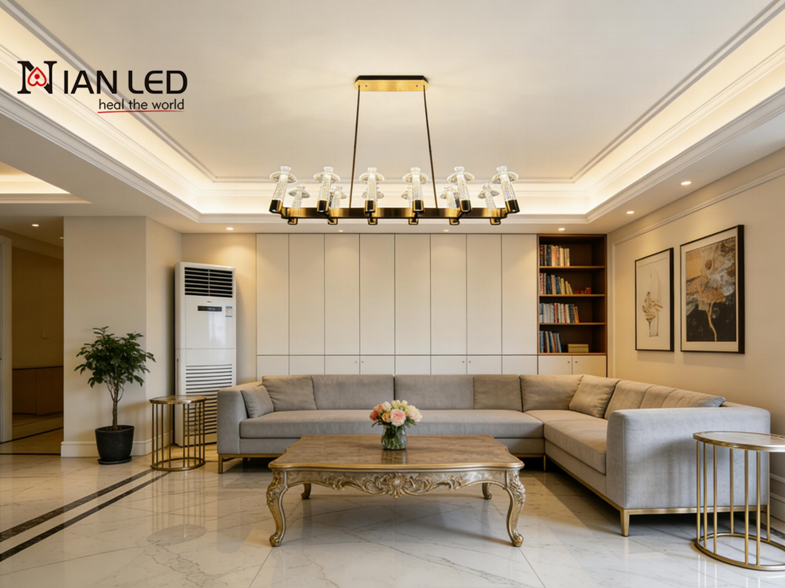 12-light linear carved crystal island chandelier with brushed brass stainless steel frame glowing in warm 3000K light