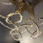 Luxury modern gold branching pendant light from Nianled, featuring interlocking organic loops of zinc alloy and sparkling crushed acrylic