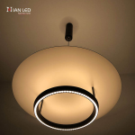Modern eclipse circular ring aluminum LED pendant light with matte black ring and glowing aluminum reflector disc against grey background