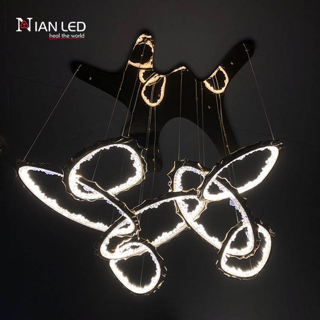 Luxury modern gold branching pendant light from Nianled, featuring interlocking organic loops of zinc alloy and sparkling crushed acrylic