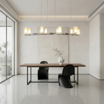 Glowing modern branching node linear LED chandelier with glass cylinder cups illuminated in living room