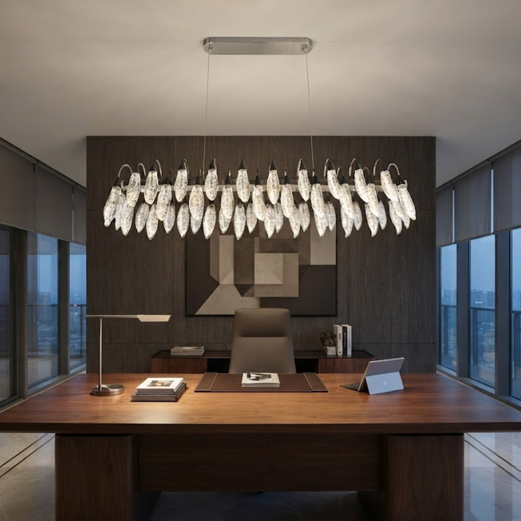 Large crystal-texture feather linear LED chandelier hanging above a luxury marble hotel reception desk in a contemporary lobby
